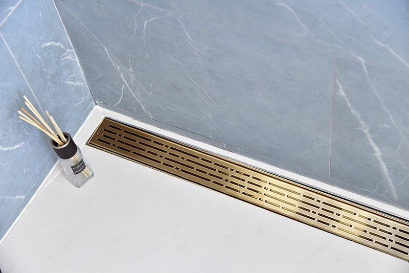 Satin Gold Linear Shower Drain with Free Hair Trap, Broken Lane Design, By SereneDrains